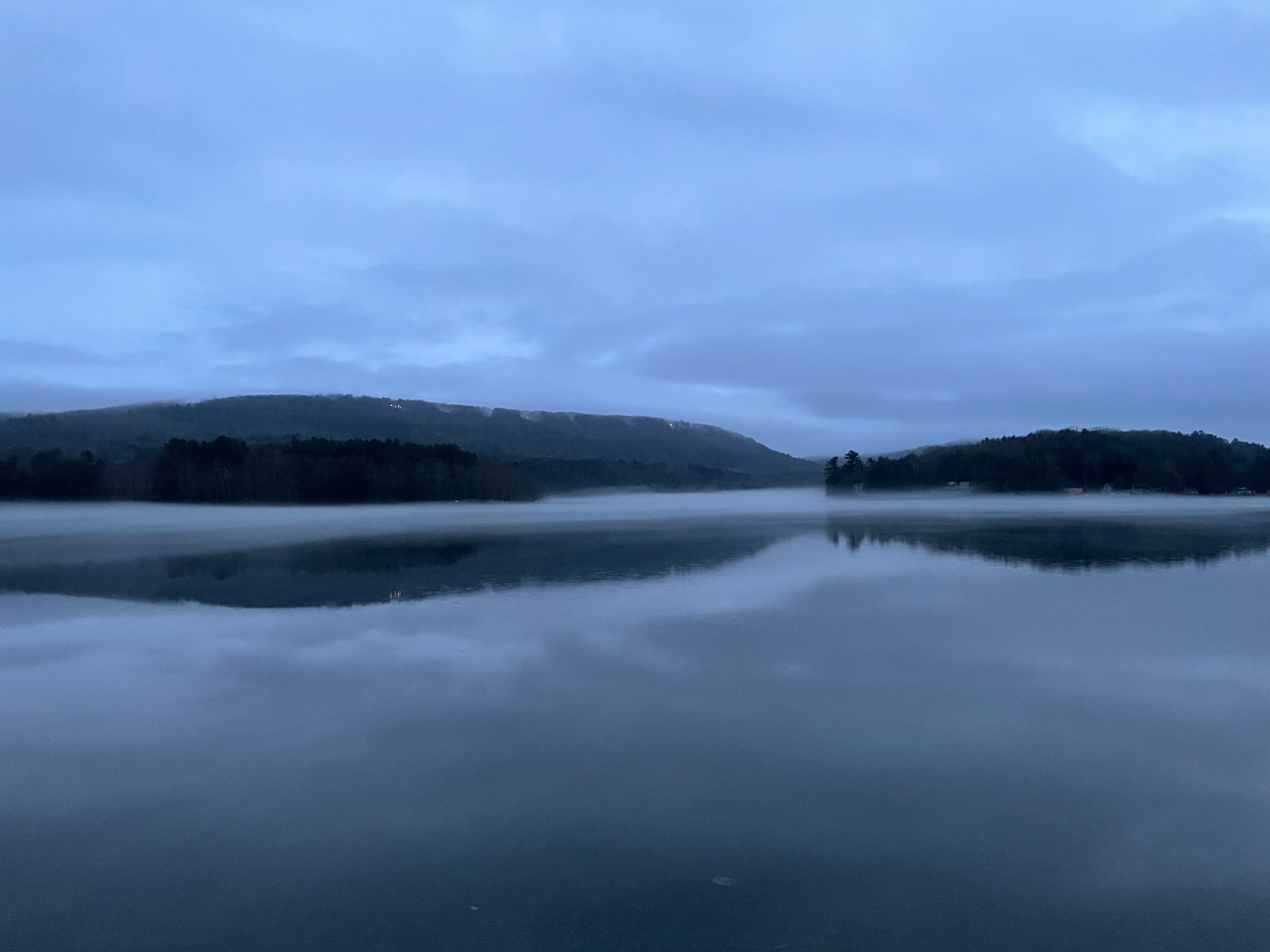 Dawn mist over Queechy Lake at dusk